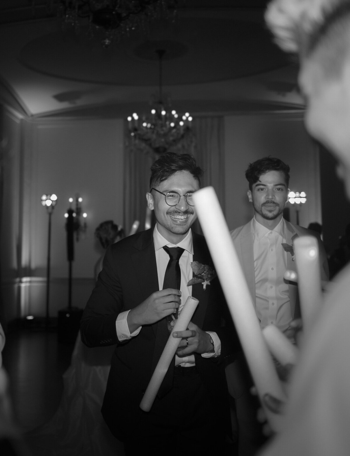 A groom laughs on the dance floor, The Colony Club Detroit wedding reception