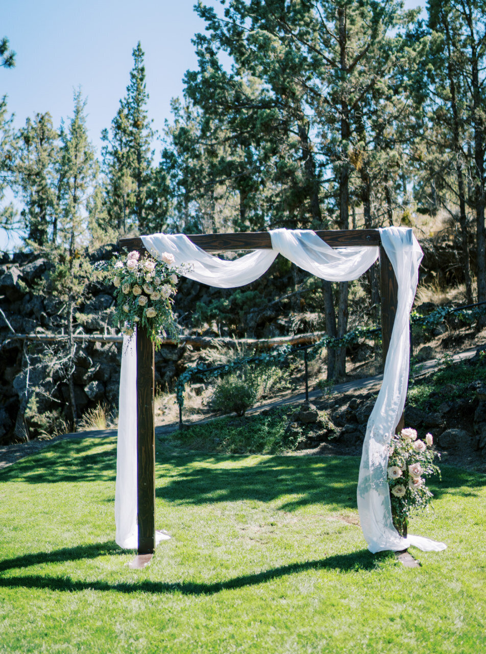 outdoor wedding wood ceremony arch draping