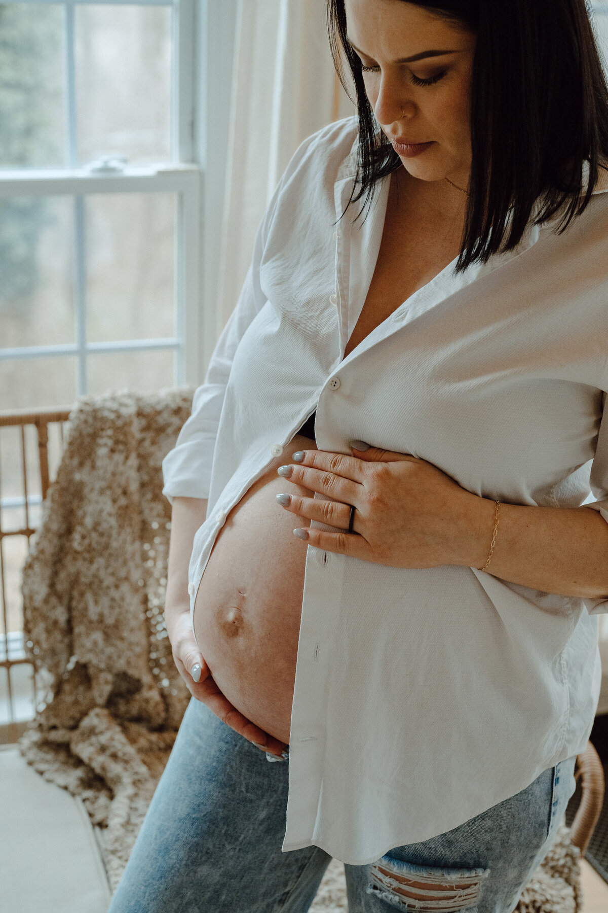 Maternity portrait of a mother holding her belly 