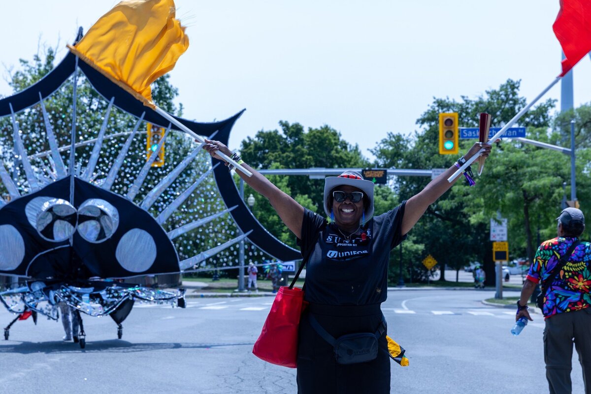 Toronto caribbean carnival parade masqueraders having fun in costume with Sunlime Mas, the number 1 medium size band at Toronto Carnival.