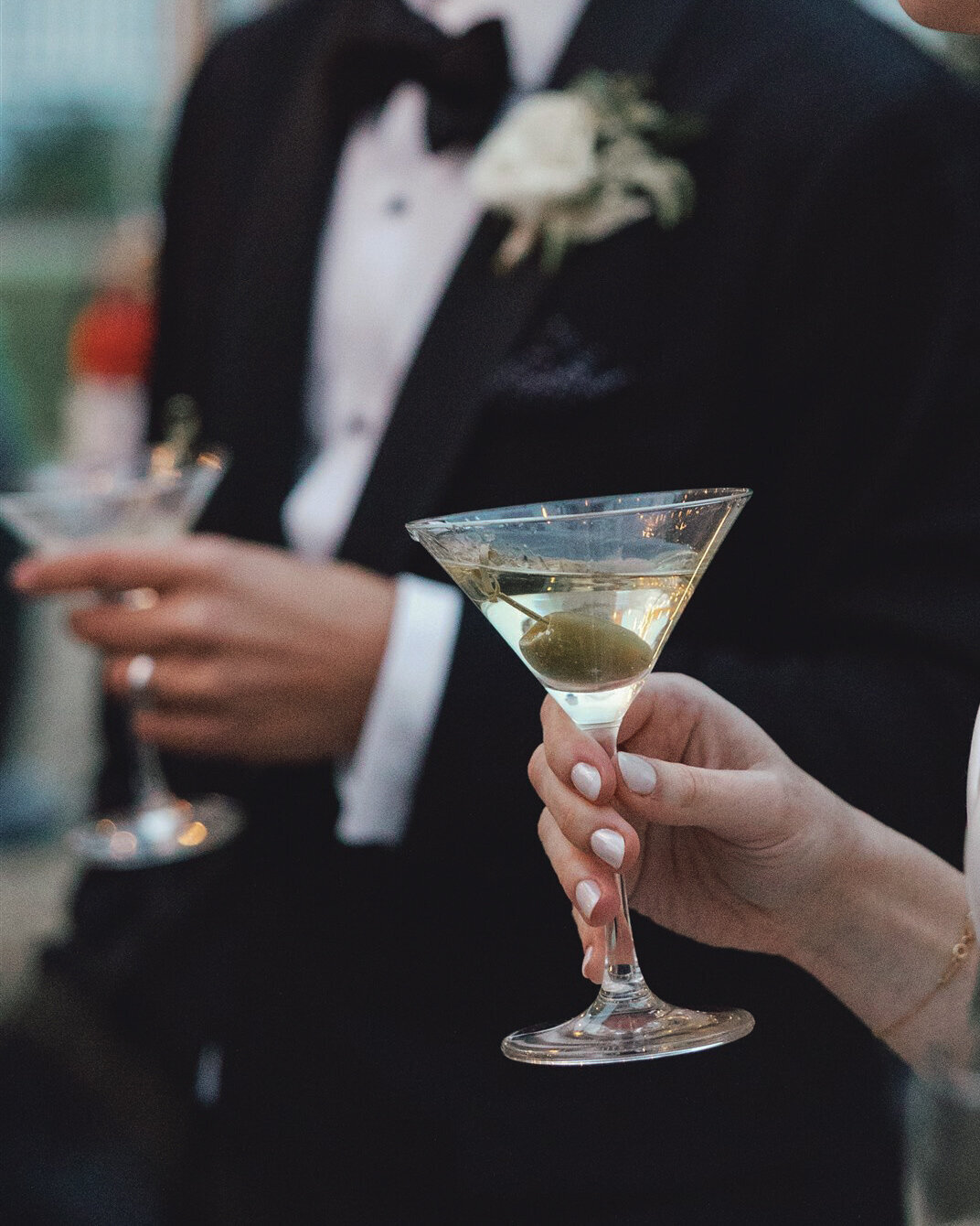 Couple holding champagne glasses during wedding at Mattei's Tavern in Los Olivios