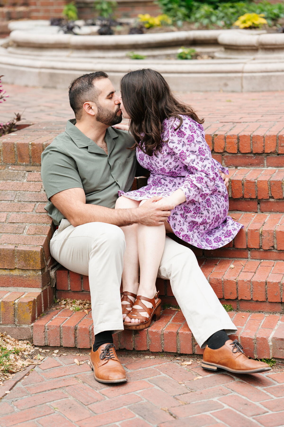 Couple walking through the rose garden at Lynch Park during their Beverly engagement session with Danielle Littles Photography