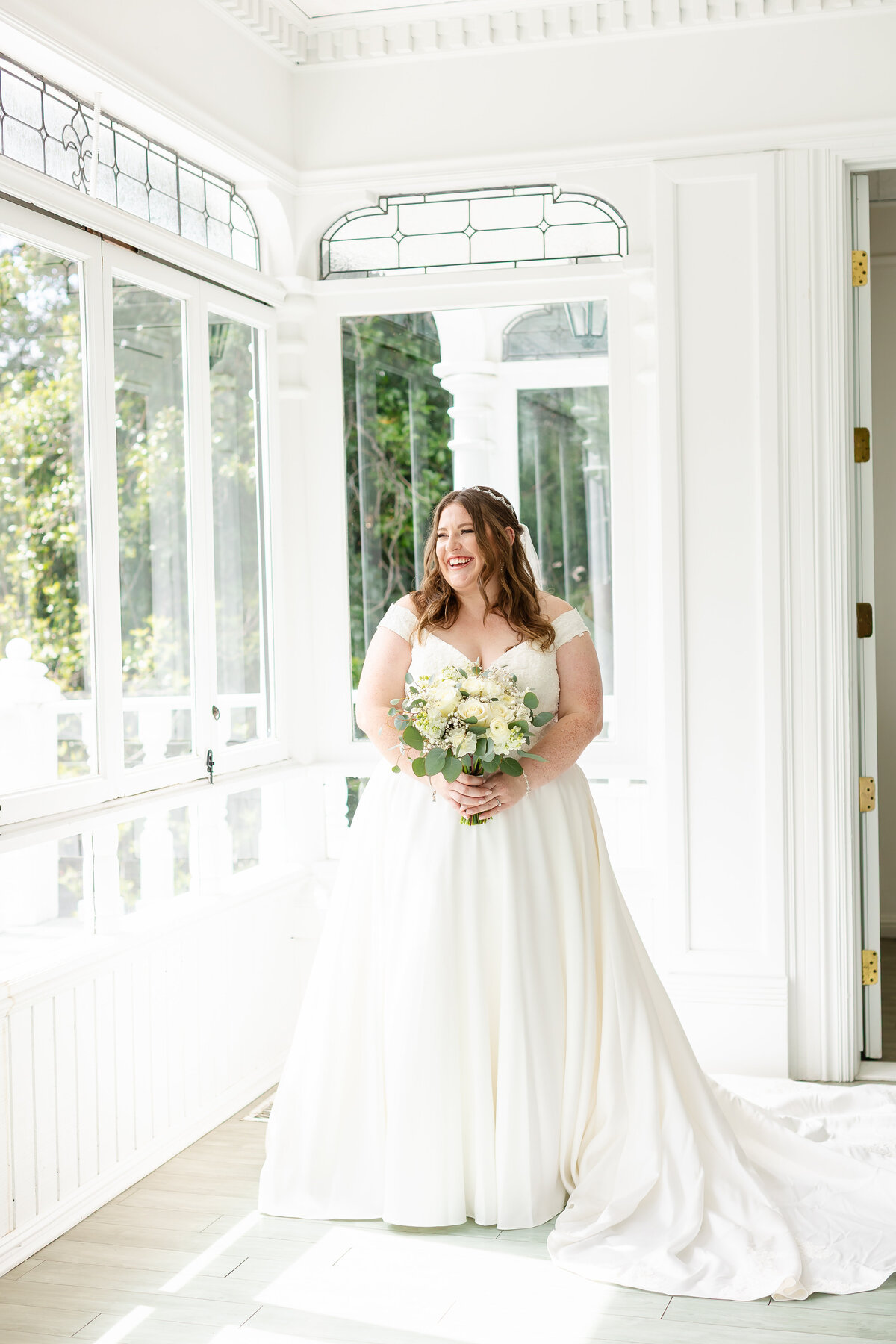 Beautiful bride holding a flower 