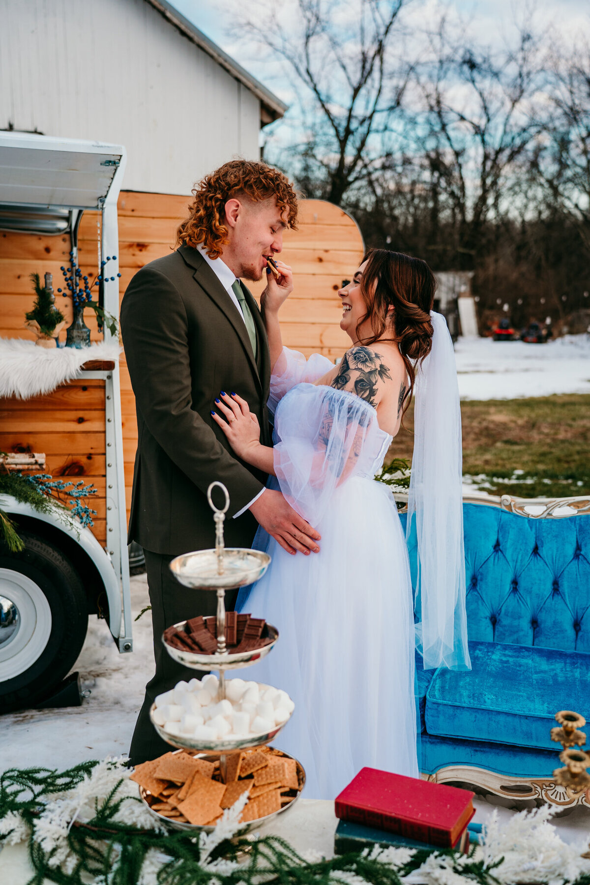 Whimsical elopement with bride in lavender gown and vintage trailer setup