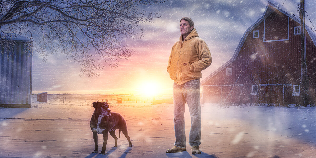 farmer standing with dog and sunrise