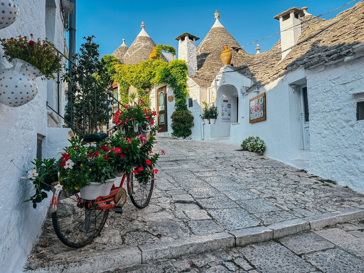 Walking through the streets of Alberobello, Italy. Marvelling at the unique trullo buildings and the UNESCO world heritage site.
