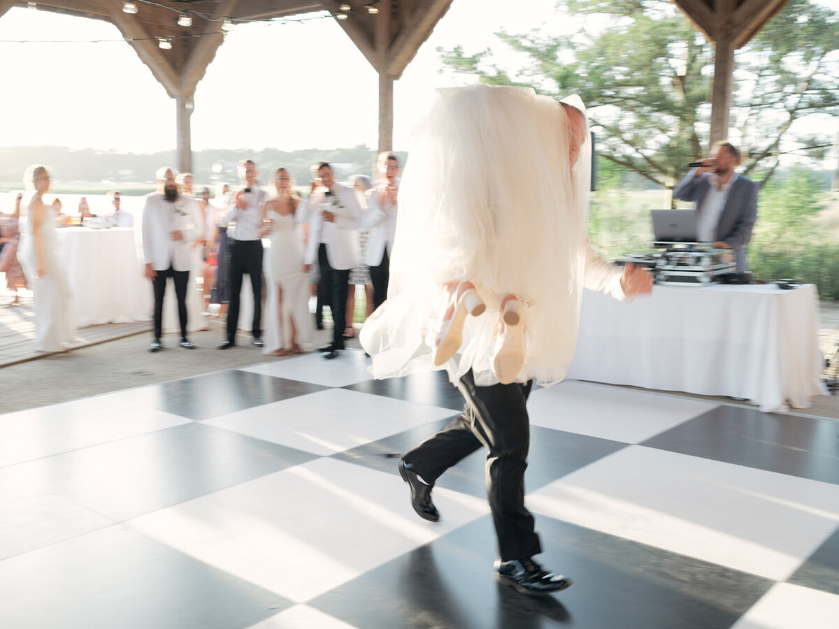 groom_carries_off_bride_boone_hall_candid_wedding_reception_first_dance_kailee_dimeglio_photography-893_websize