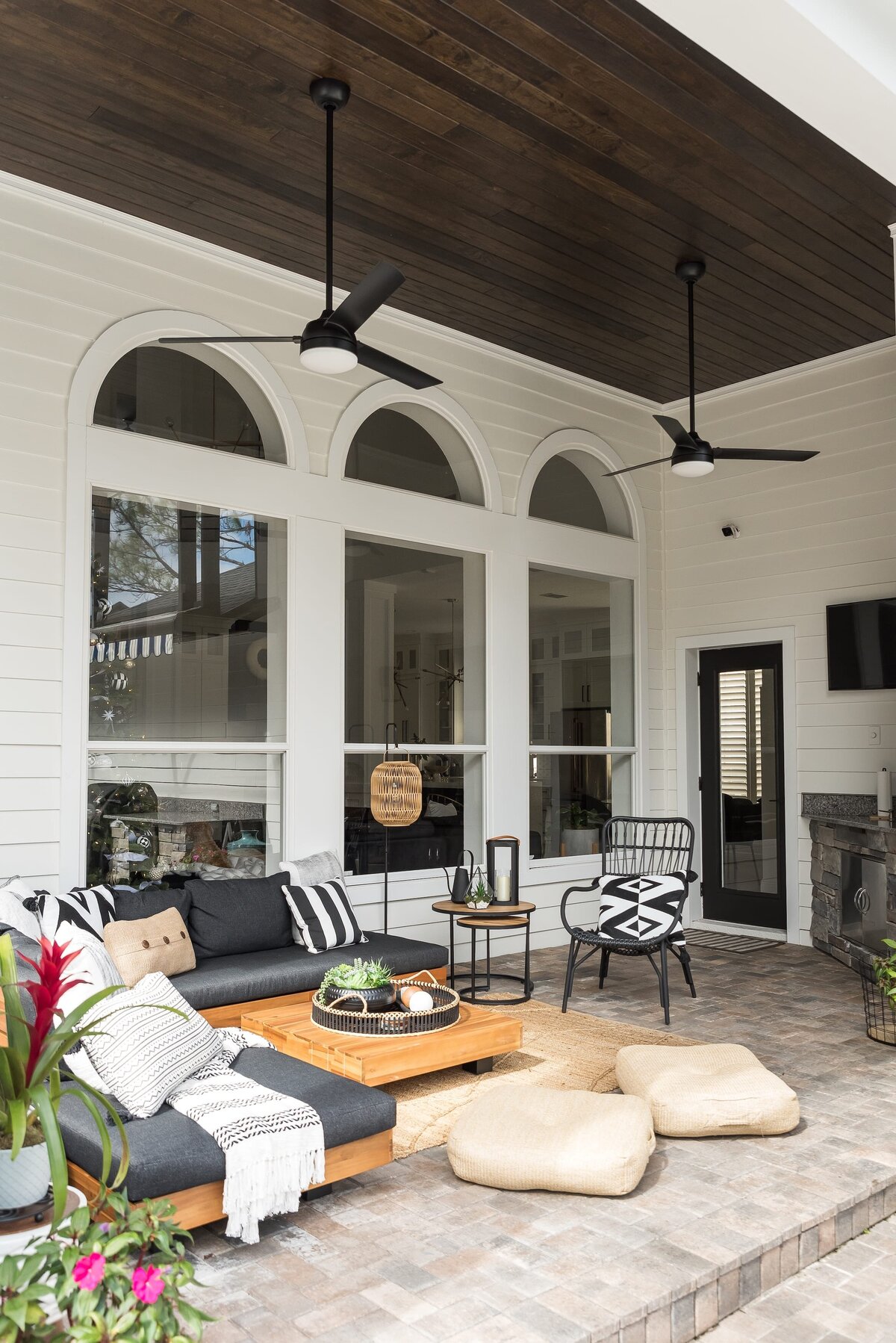 dewine design orlando interior designer modern lakehouse patio with large ceiling fans and dark wood ceiling