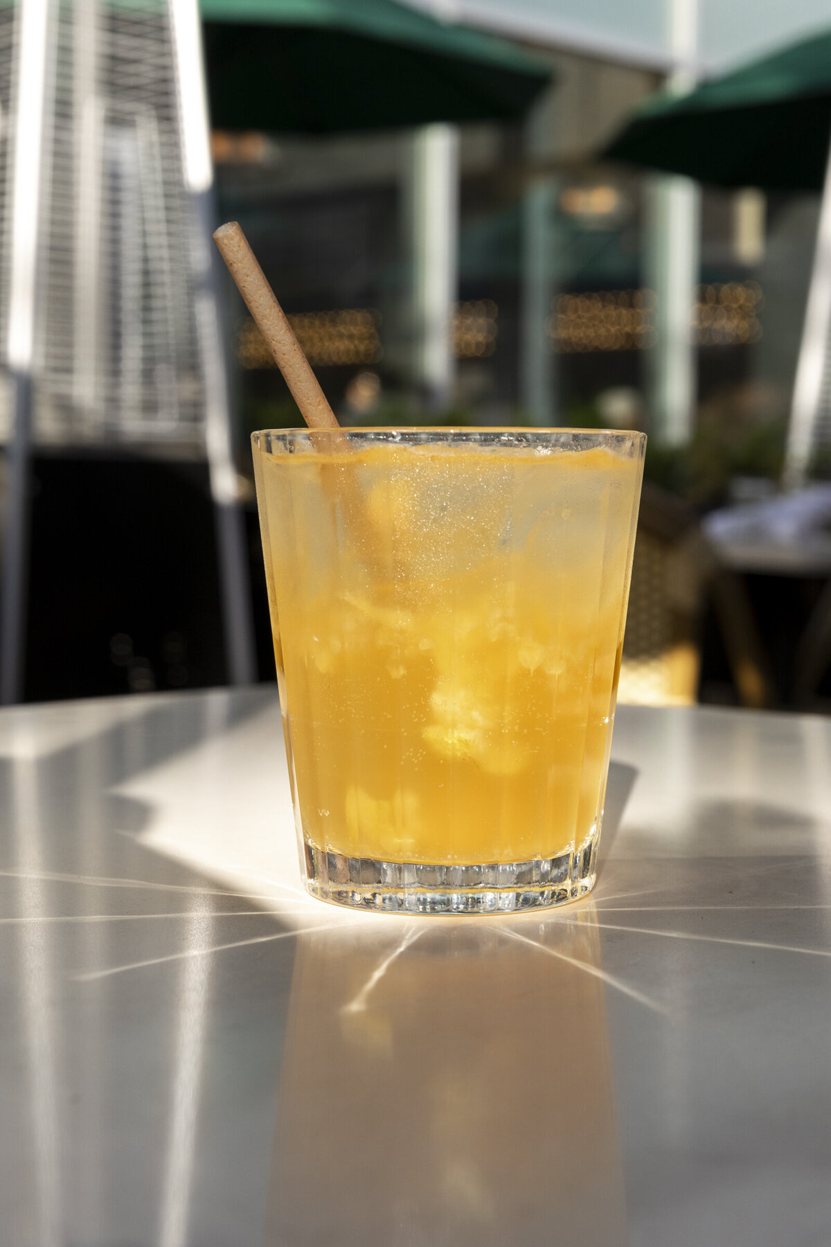 Dark and Stormy cocktail pictured on a patio table.