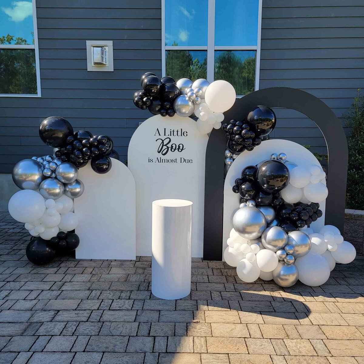 Raleigh event with Air with Flair decor's custom black and white Balloon Installation. Immerse the venue in the sophistication of our expertly crafted balloon artistry, creating a unique and memorable atmosphere.