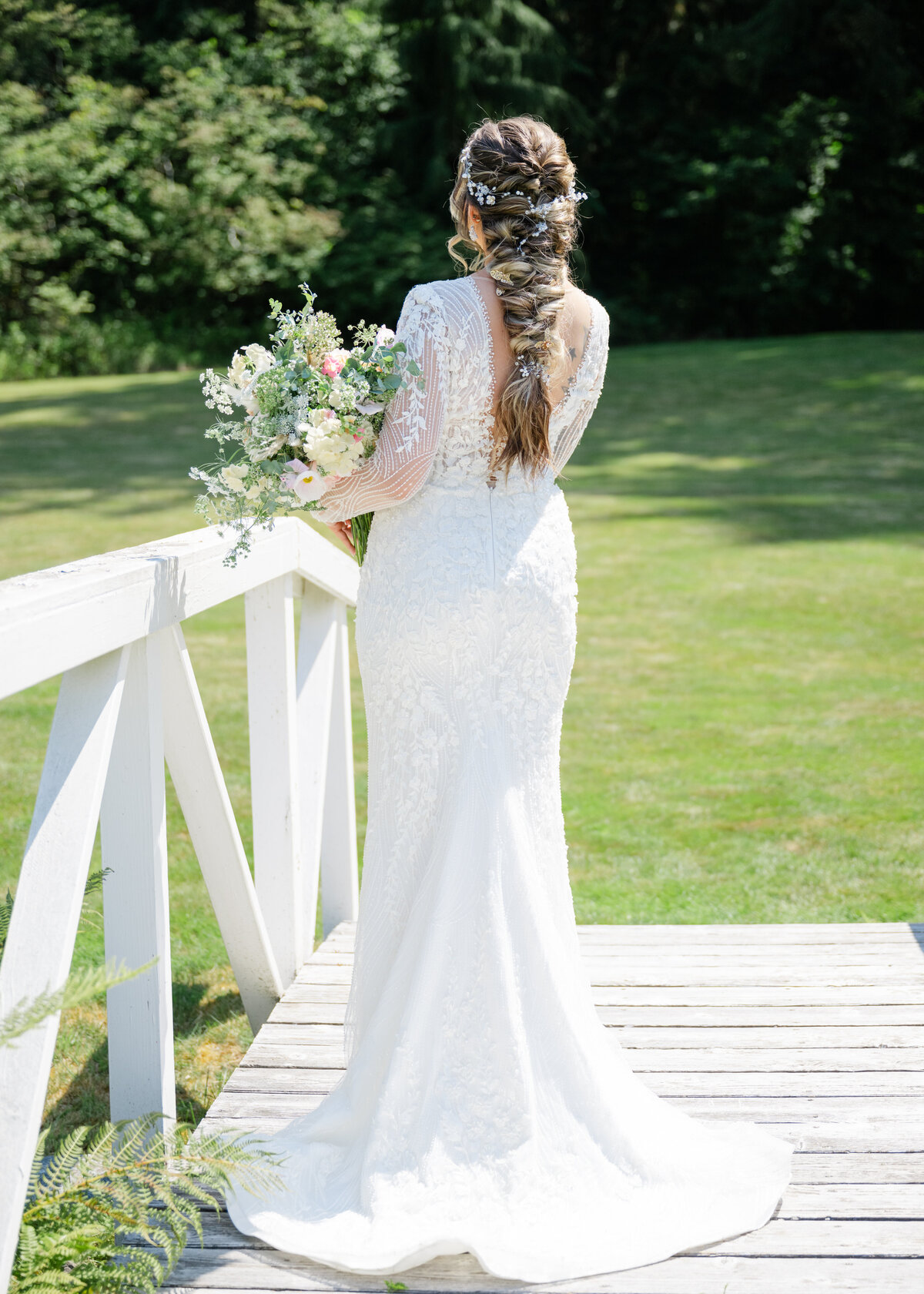the natures connection wedding venue bridal portrait on white bridge 