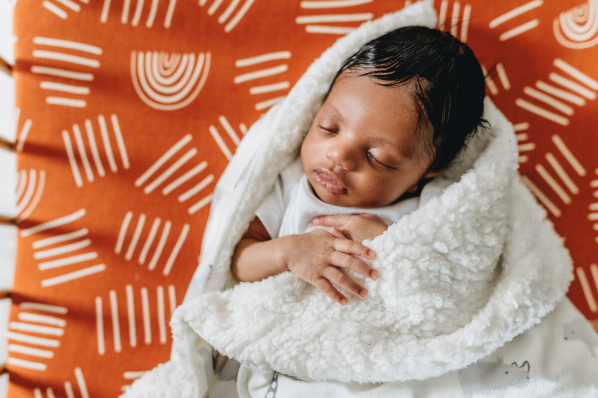 Infant baby sleeping in crib.
