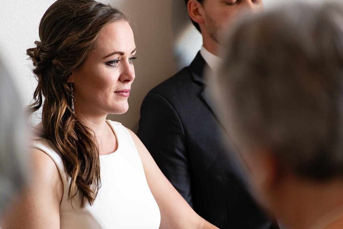 Bride tearing up during self-uniting Quaker wedding ceremony in Pittsburgh, PA