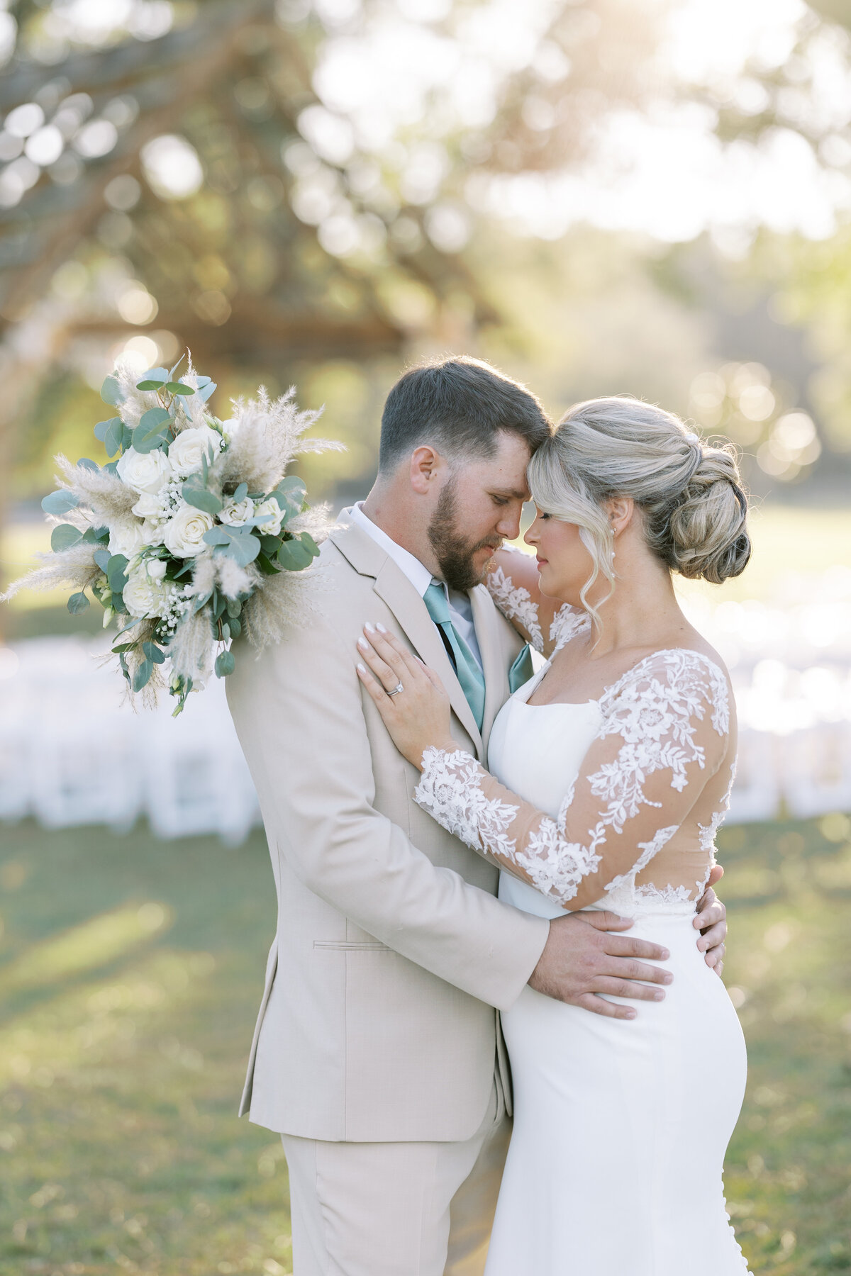 bride and groom embracing during a private moment on their wedding day