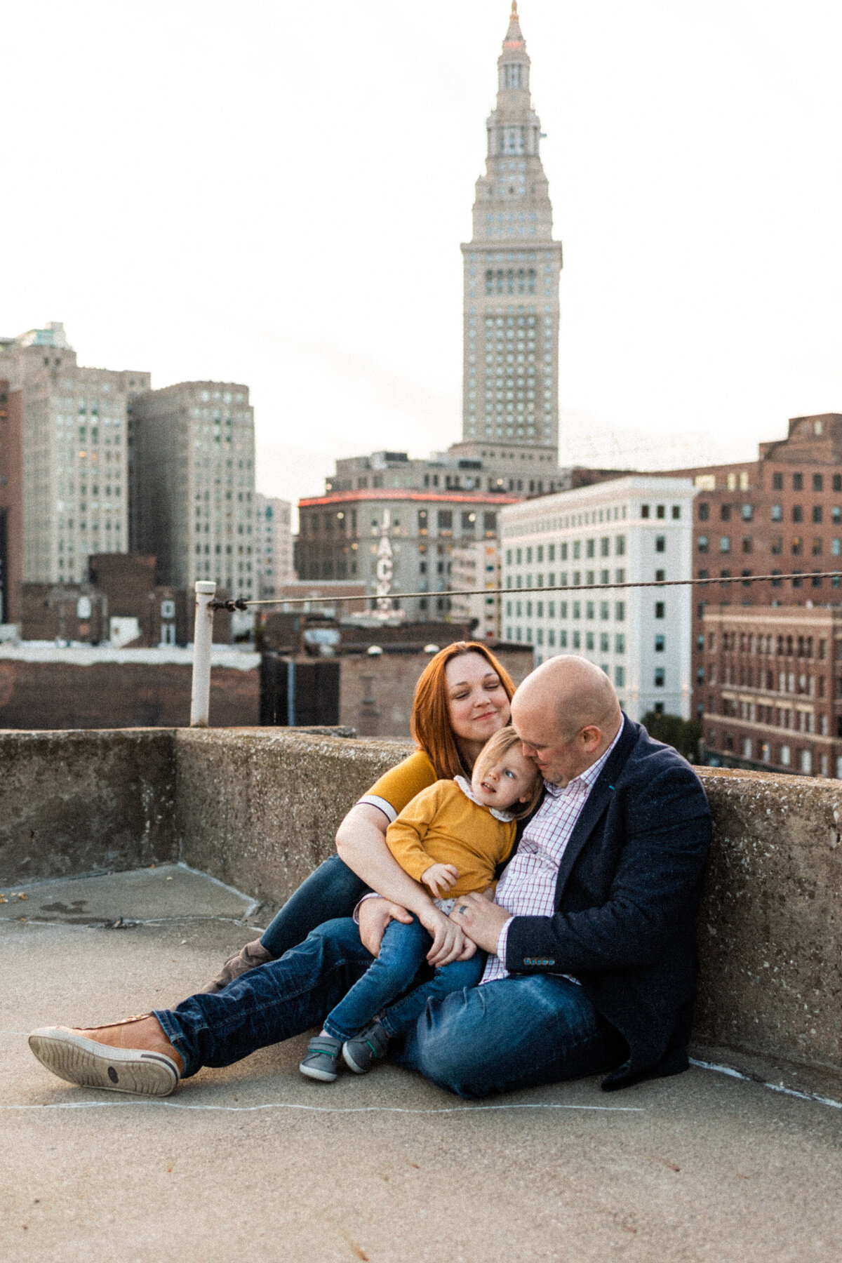Family of three on a rooftop in downtown Cleveland, Ohio