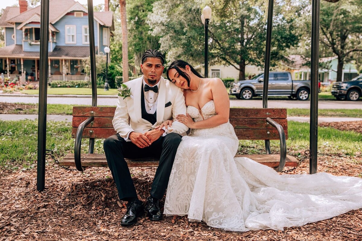 couples portrait on swing in downtown sanford florida