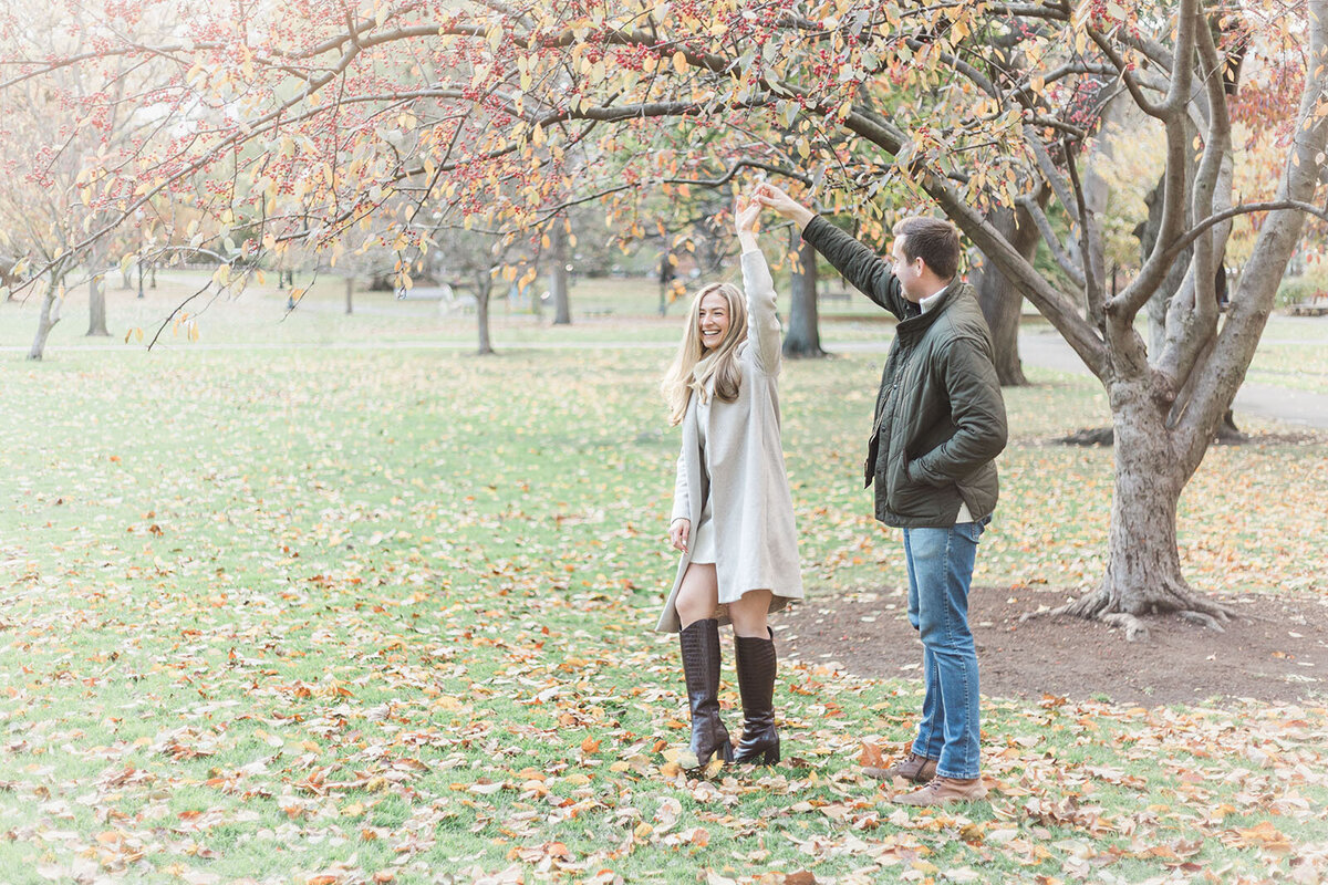Couple dances during their engagement session in Boston, Massachusetts
