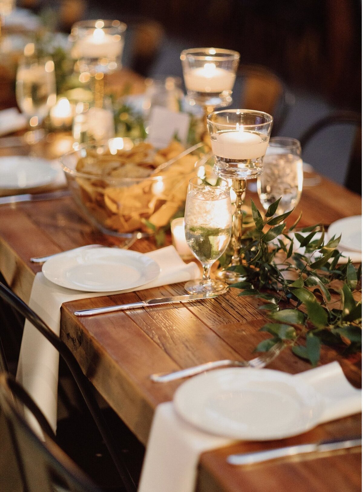 Long wood table at wedding reception