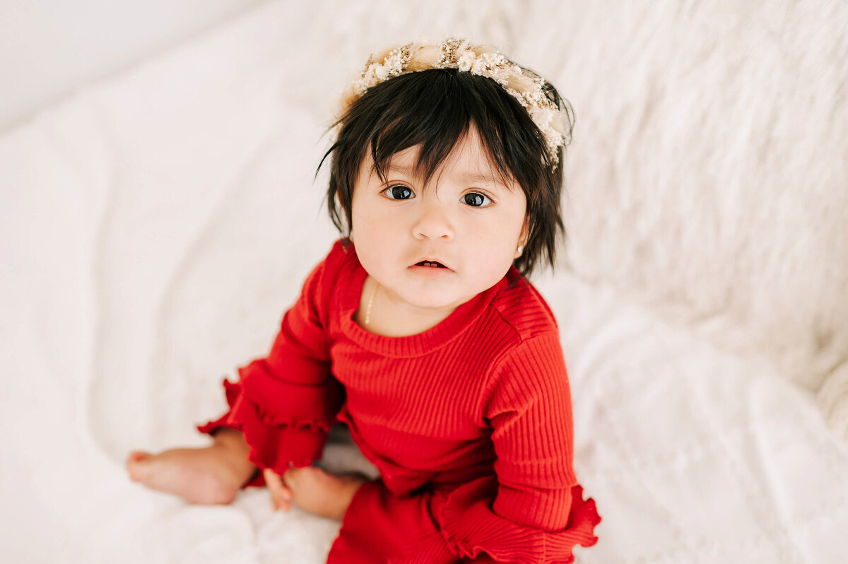 baby girl in red  captured by  Branson MO baby photographer Jessica Kennedy of The XO Photography