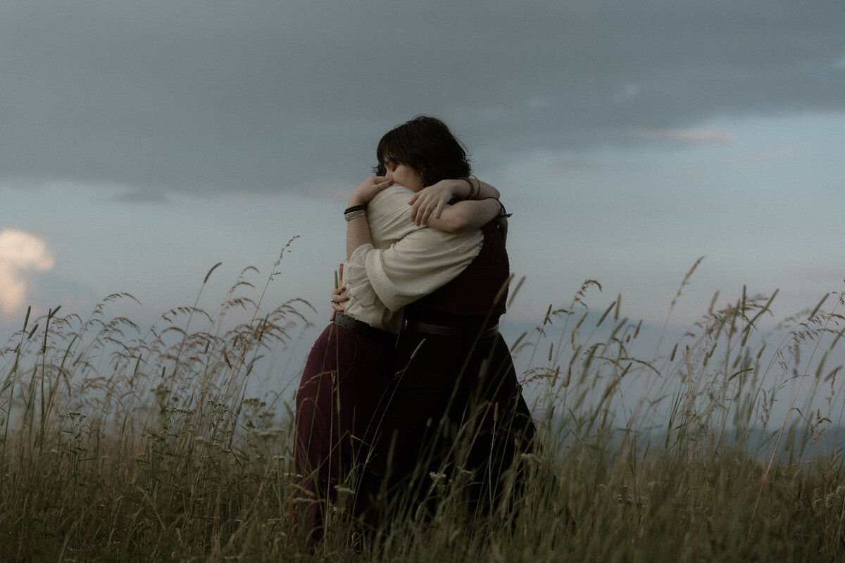 bride and groom embrace at grand teton nation al park in wyoming