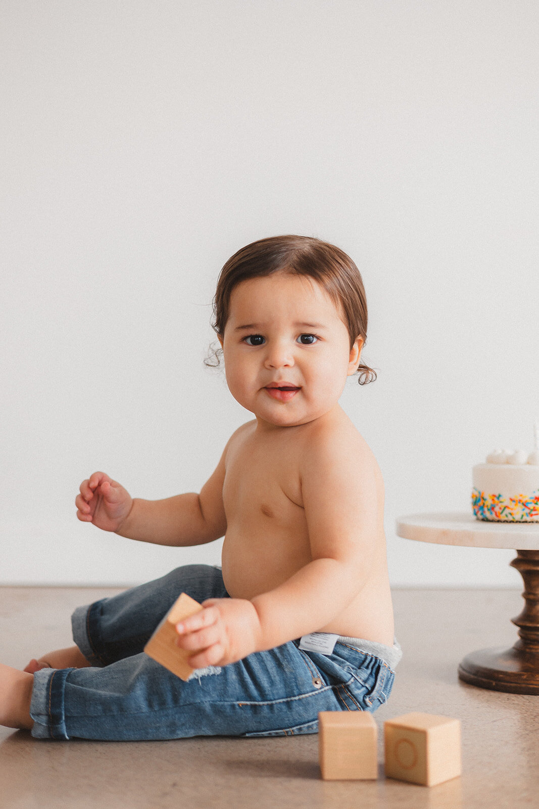 A little boy plays with blocks.