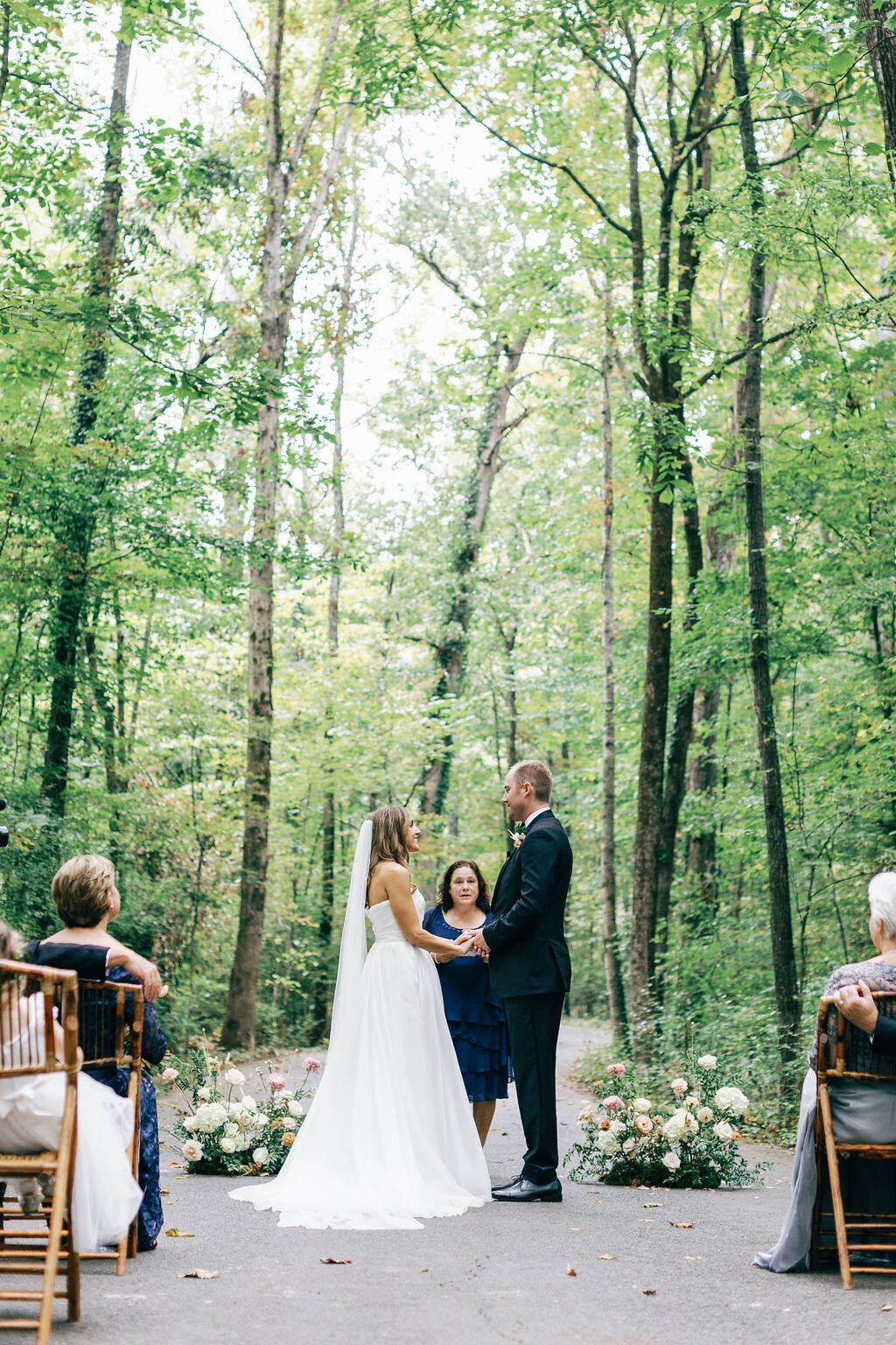 Autumnal wedding floral design at RT Lodge featuring ranunculus, garden roses, and dried flowers in a neutral fall color palette. Design by Rosemary and Finch in Nashville, TN.