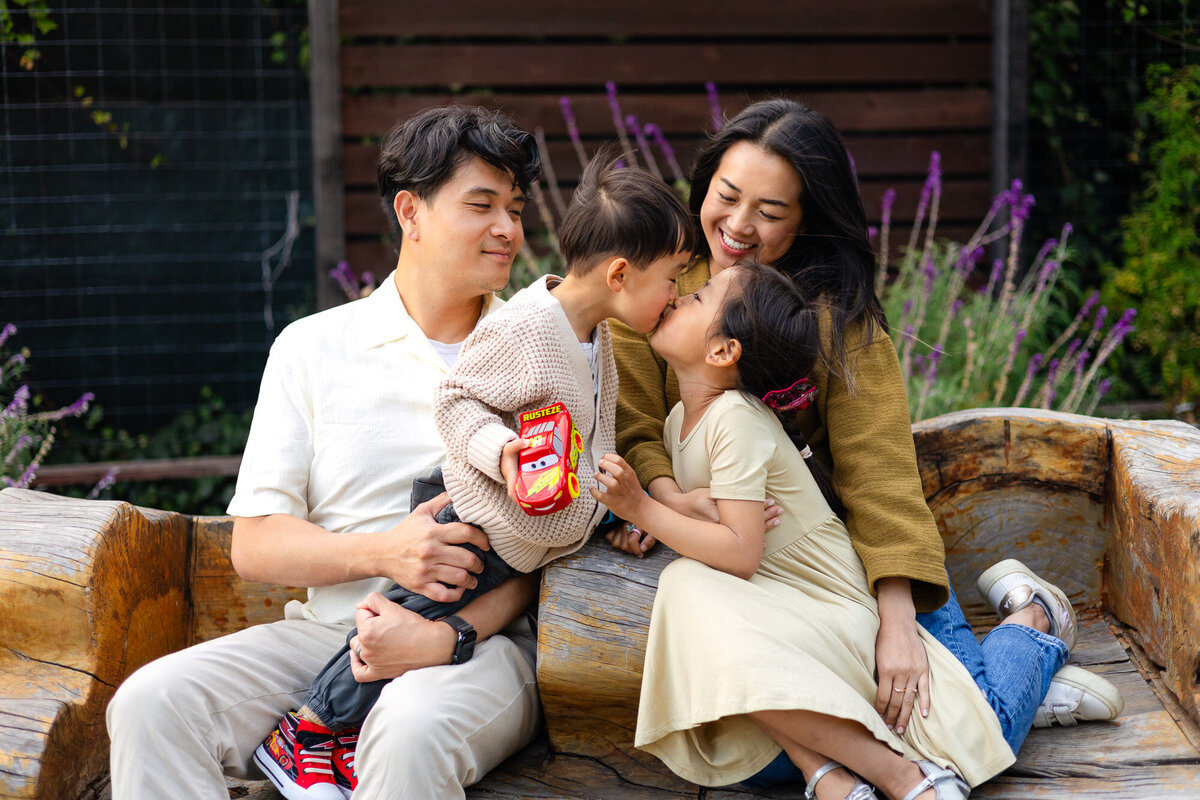 Sweet sibling kiss during cozy family moment – Bay Area Family Portfolio - Ellobelle Photography Family Photographer