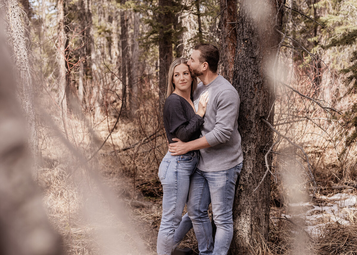 couple-photographed-through-trees