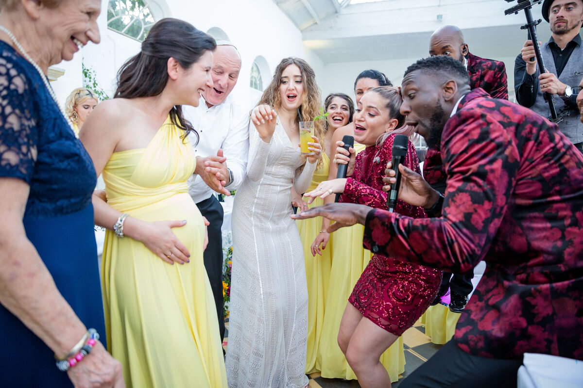The Function Band Sings to a pregnant Bridesmaid