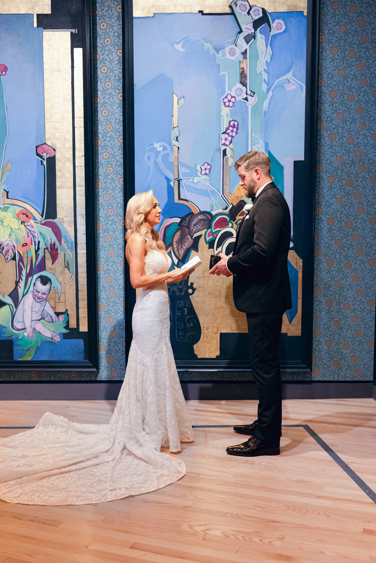 A wedding day photo of the bride & groom during their first look, at Crystal Bridges Museum of American  Art in Arkansas