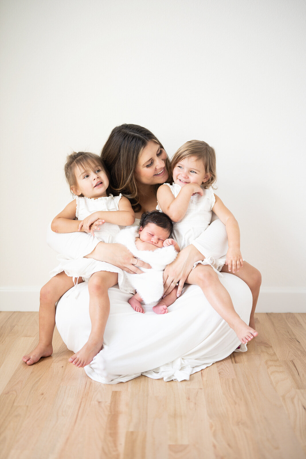 Mother with twins and newborn