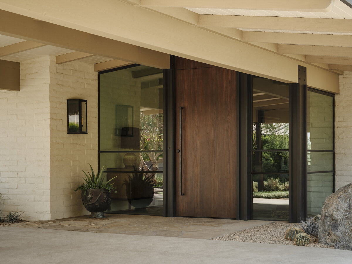 Front entry steps with window showing art designed by Palm Springs architect