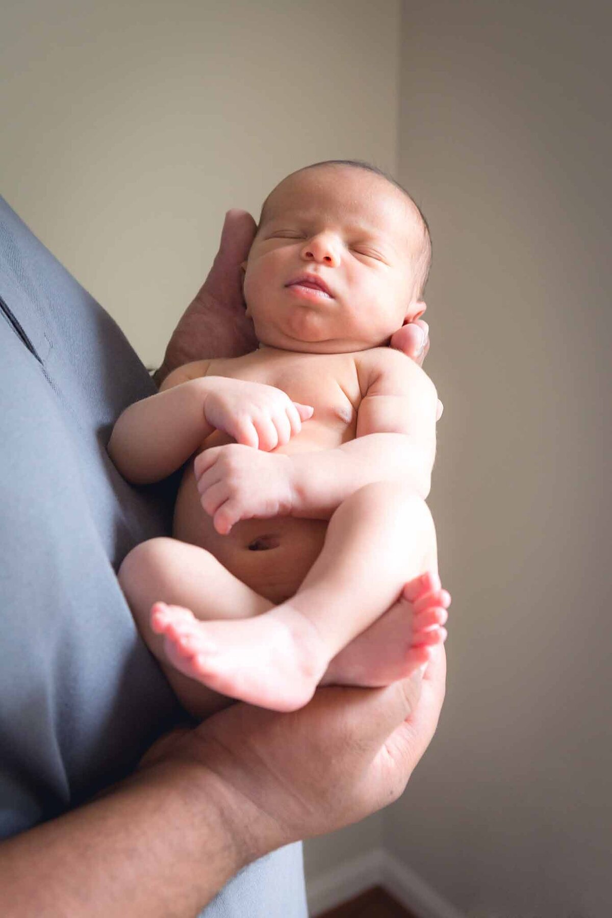 Newborn baby being held by dad in Columbia SC