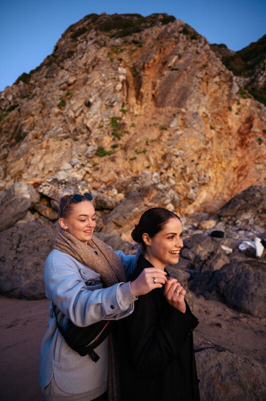 Models hair is done by a MUAH, while they are on a photoshoot on the beach near Lisbon