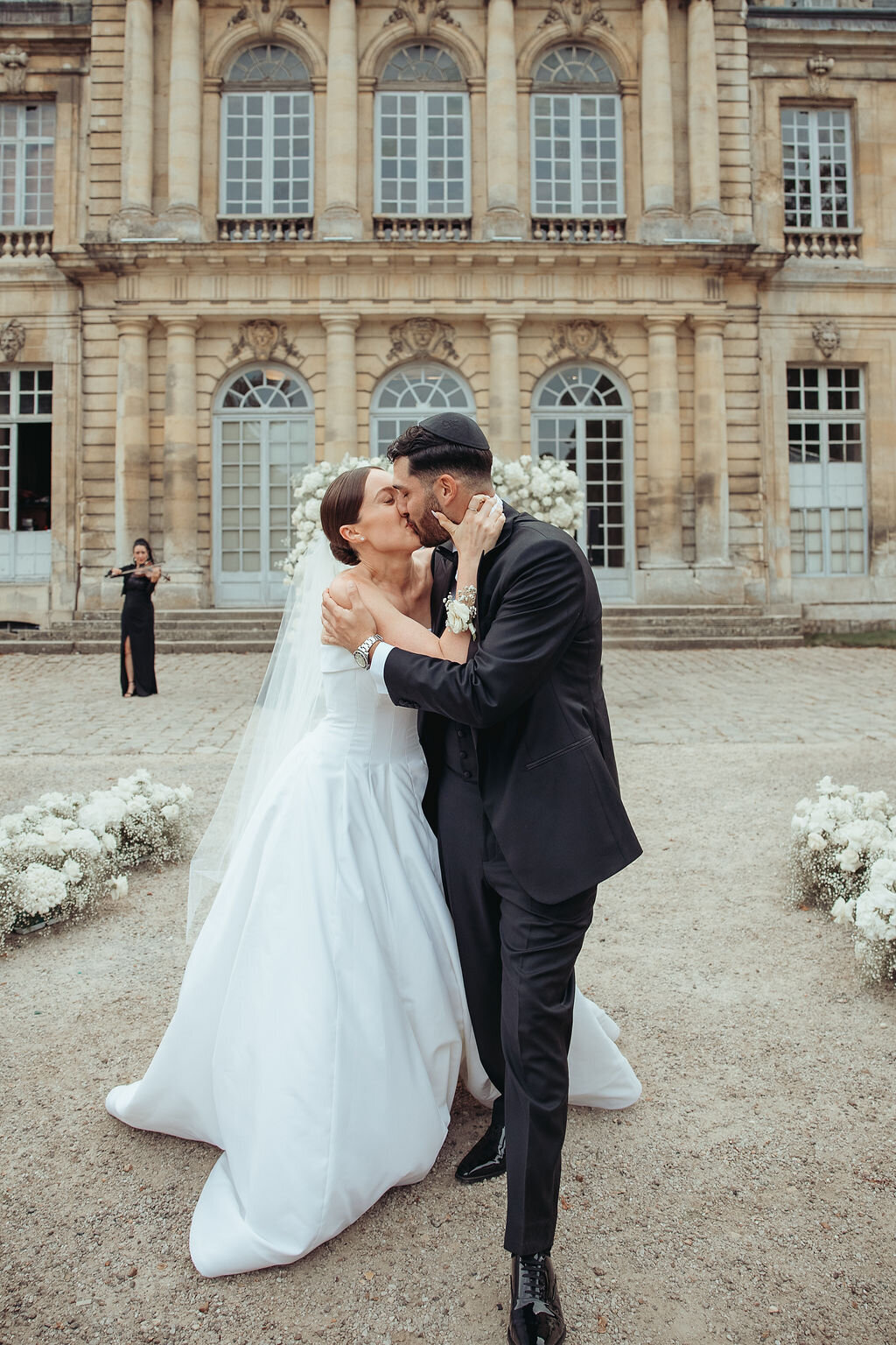 bride and groom kissing after their ceremony in France taken by a Columbus, Ohio wedding photographer
