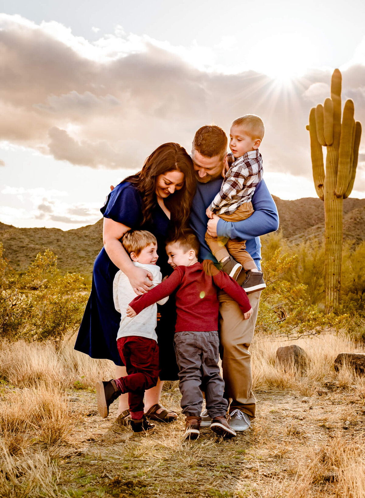 family hugging in AZ desert for family photography session
