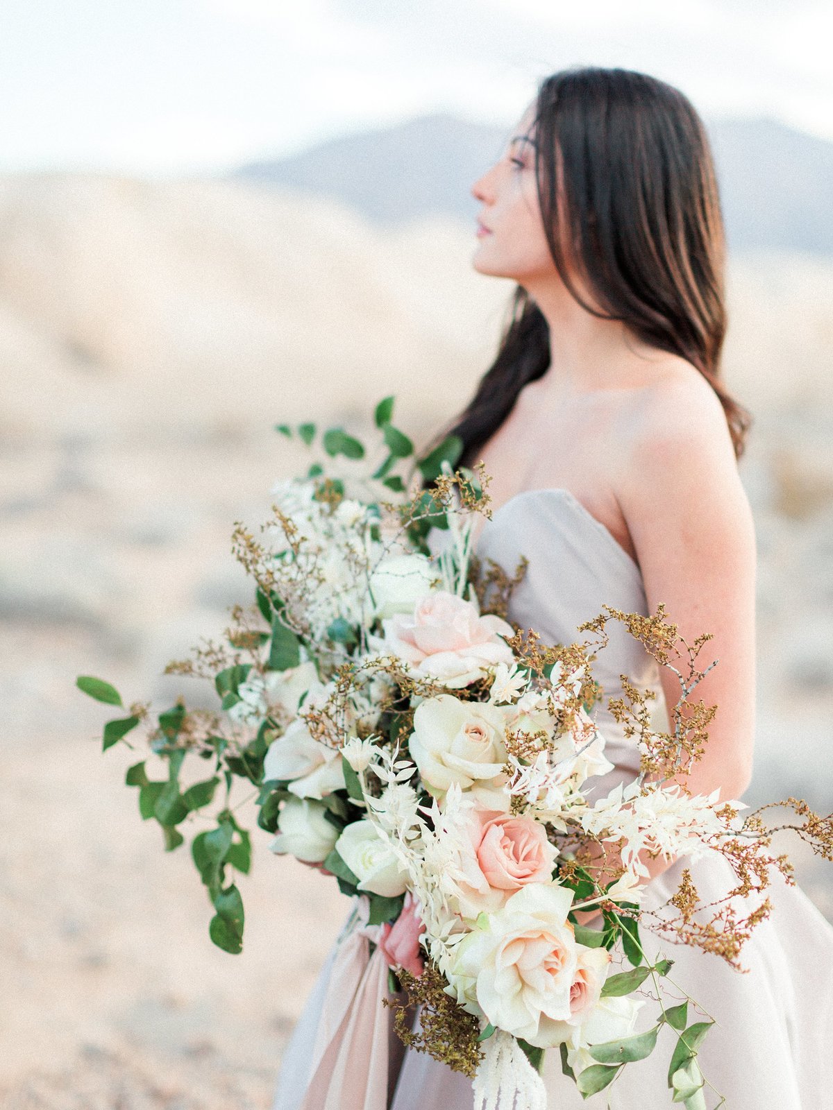 bride with flowers in the dry fossil beds in  las vegas