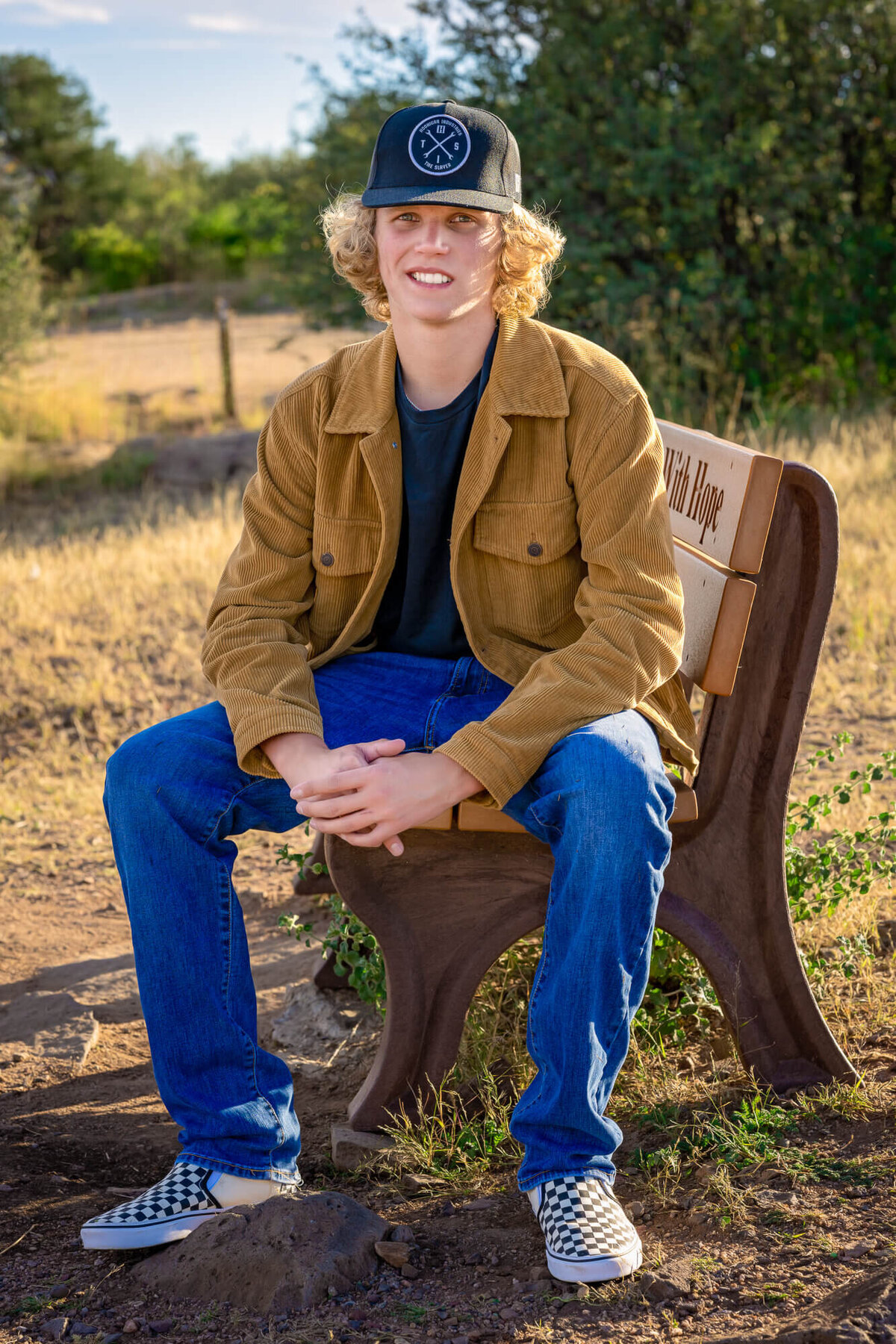 Boy poses outdoors in Prescott senior photos
