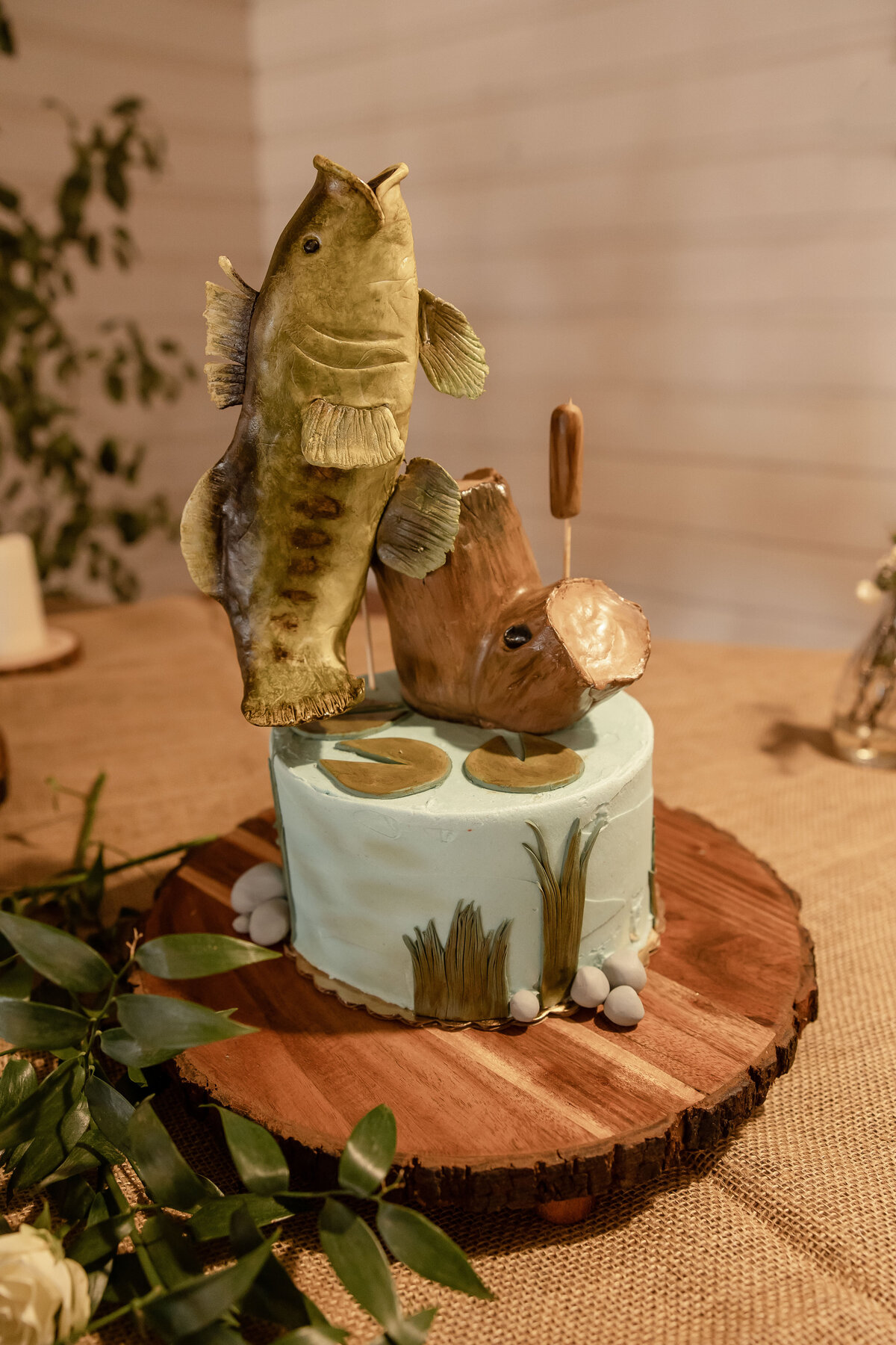 fish jumping out of water groom's cake at Texas wedding by Firefly Photography