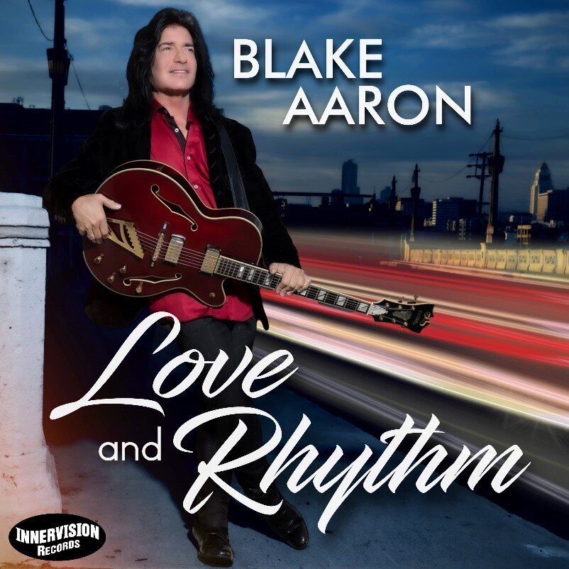 Guitarist album cover Blake Aaron Love and Rhythm standing on bridge holding guitar city background