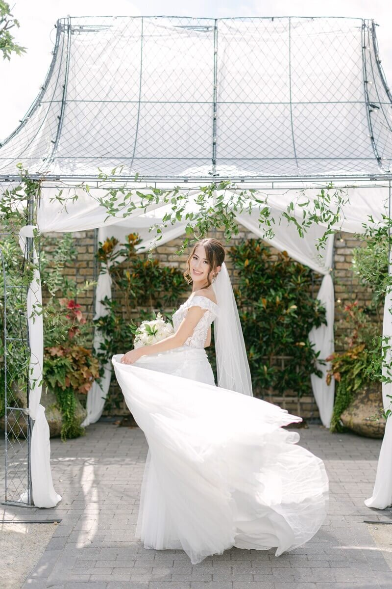 bride twirling dress at terrain