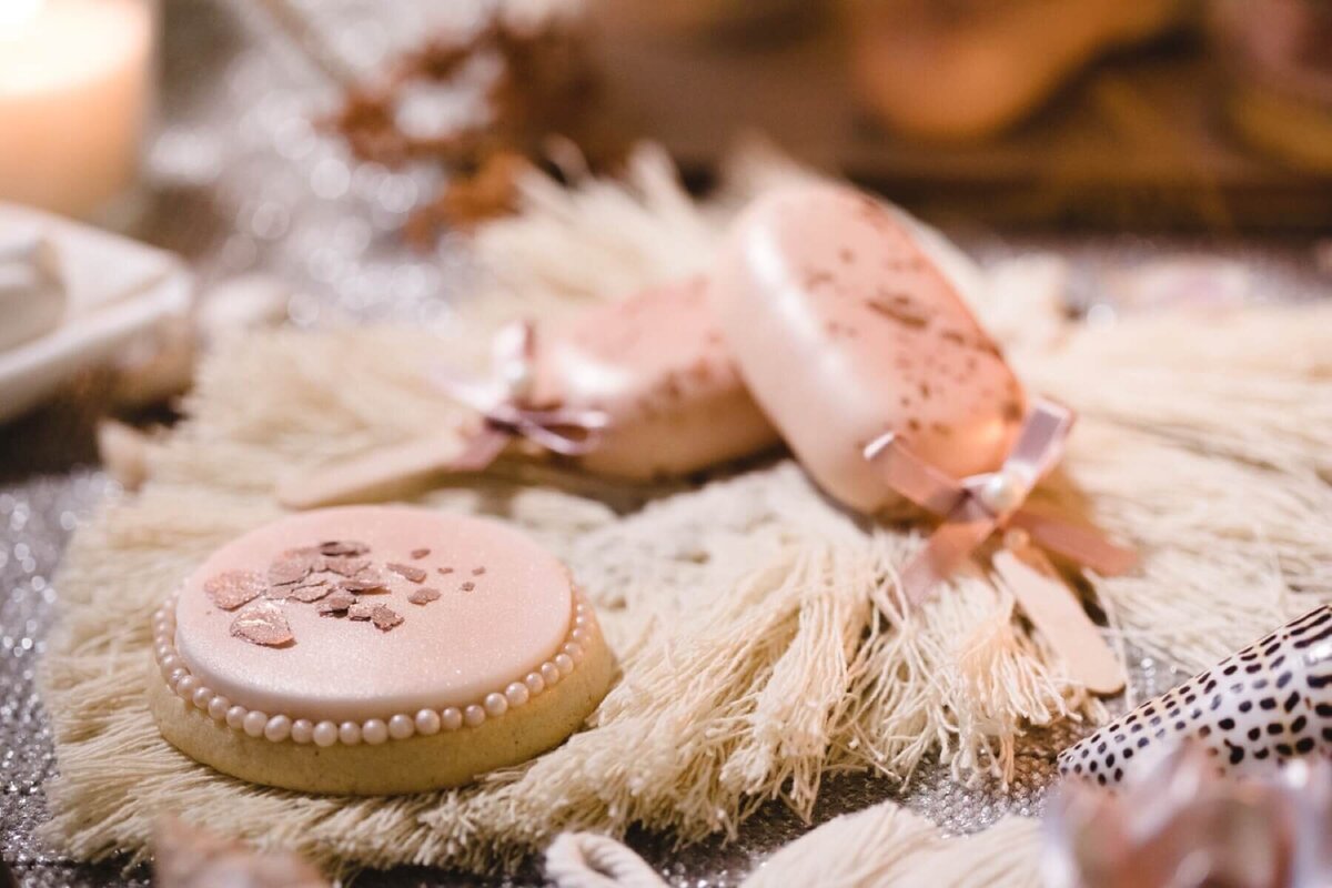 Pink iced biscuit and pink cake pops