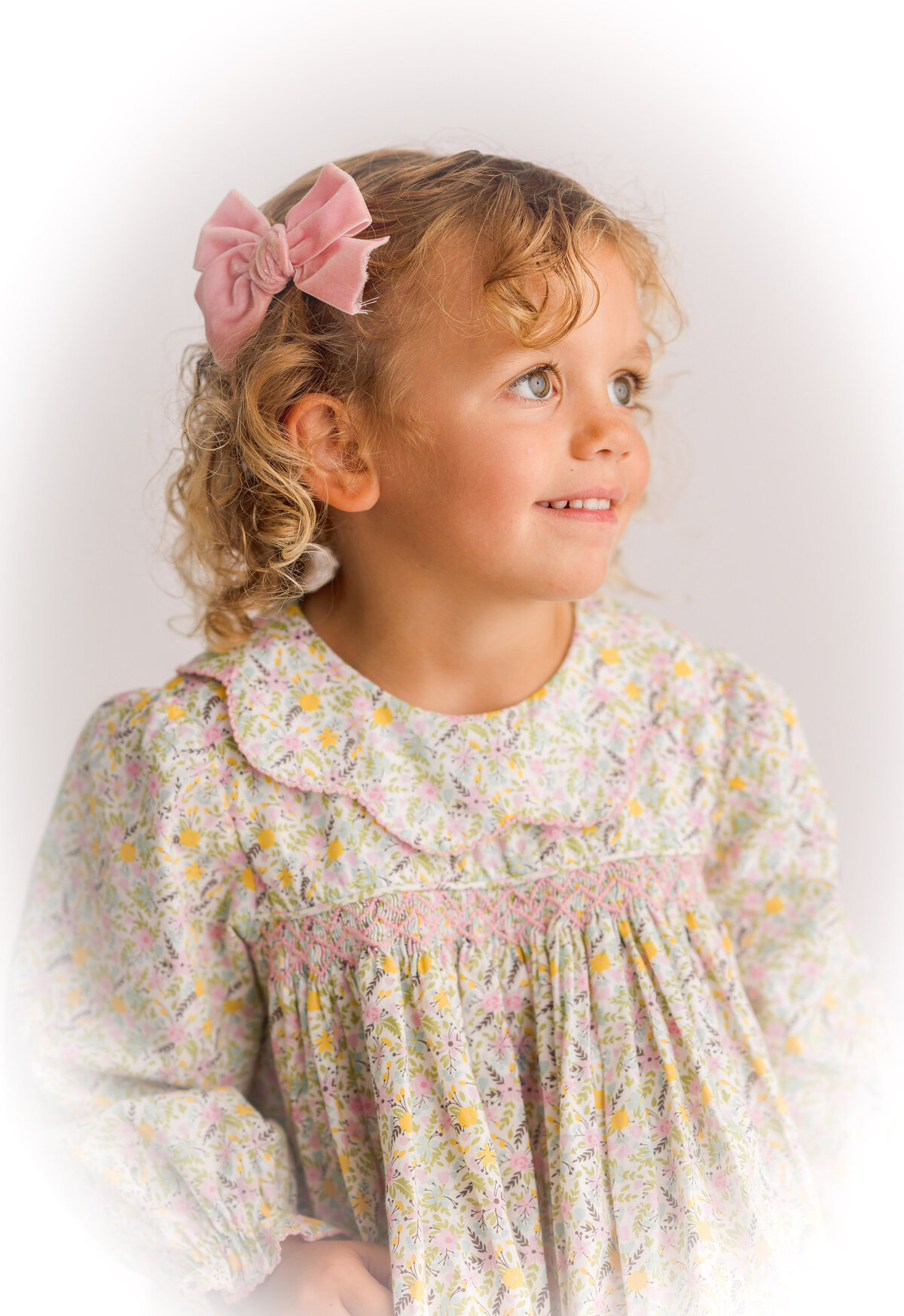 Little girl posed for Heirloom Portrait Photoshoot in Charleston, SC.