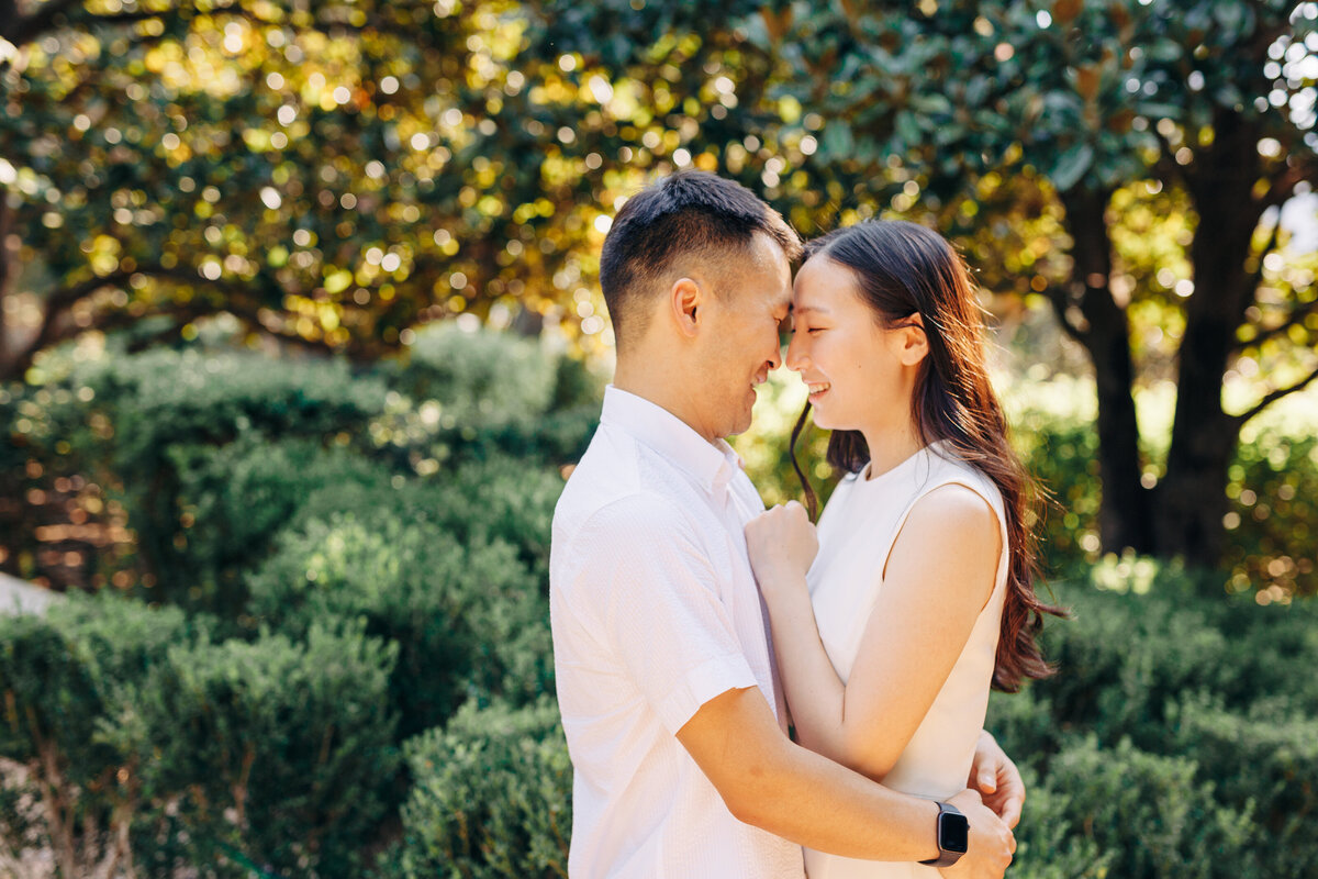 man and woman forehead to forehead  during their photo session