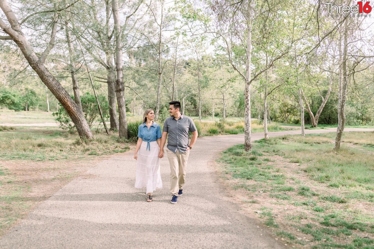 Engaged couple go for a walk at Talbert Regional Park