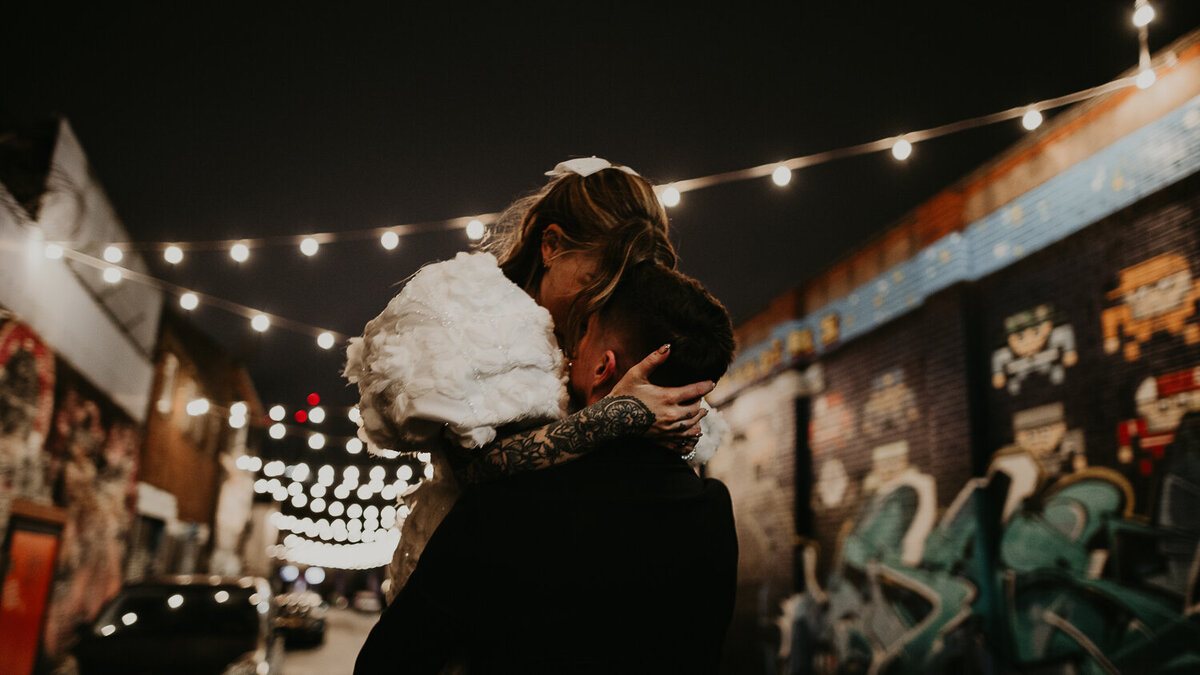 Wedding couple dance in the streets of Digbeth on their wedding day.