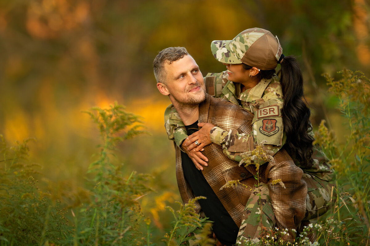 Piggy back ride for his short Hispanic military bride ISR