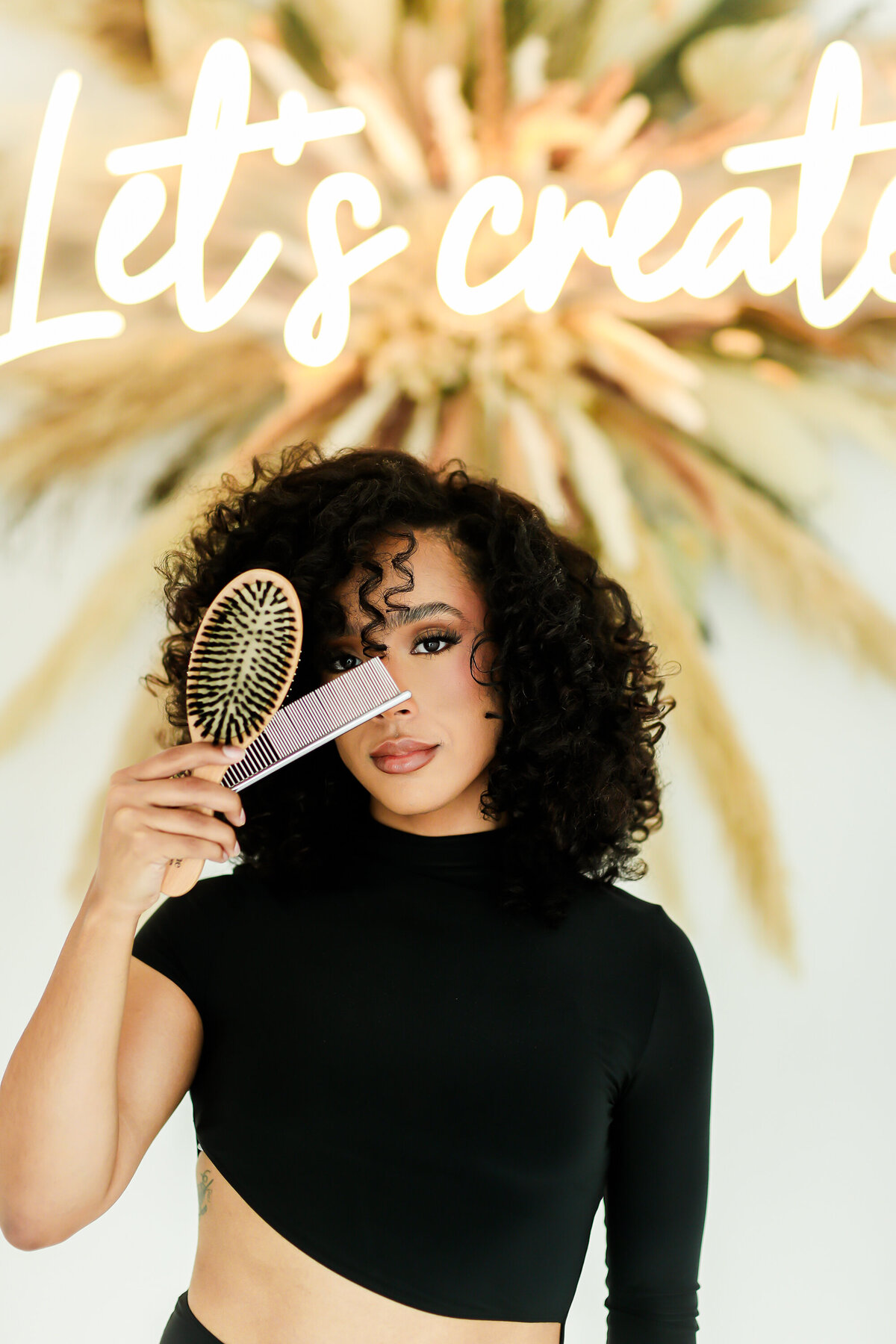 Model holding hair tools