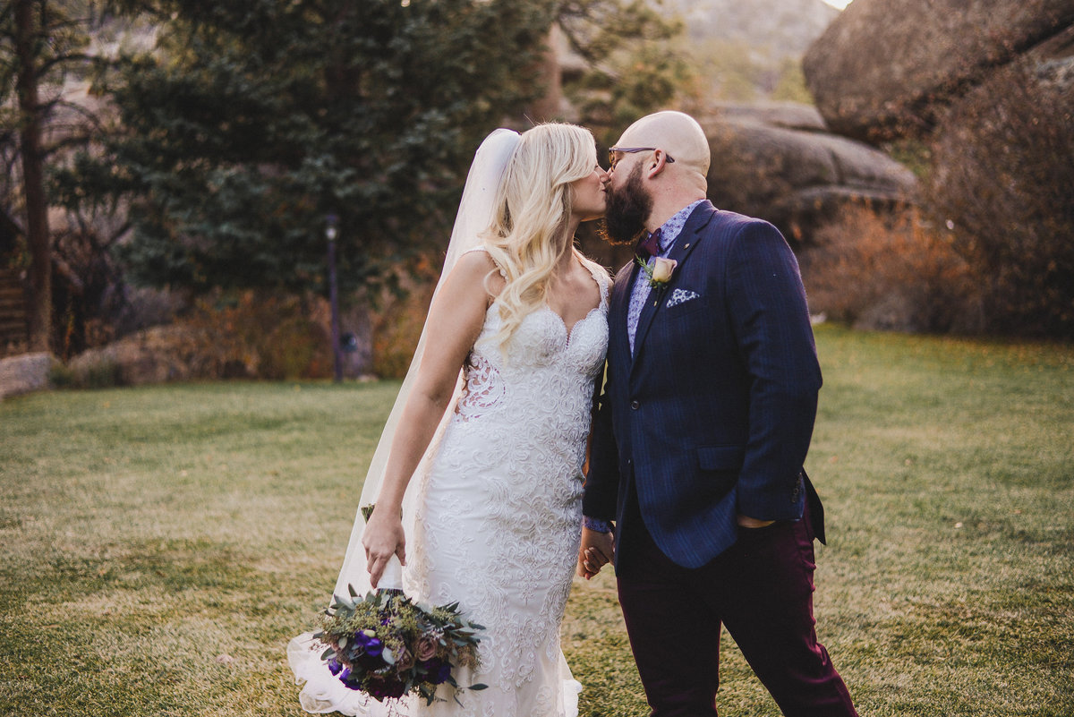 Bride and groom kissing, Colorado wedding photographer