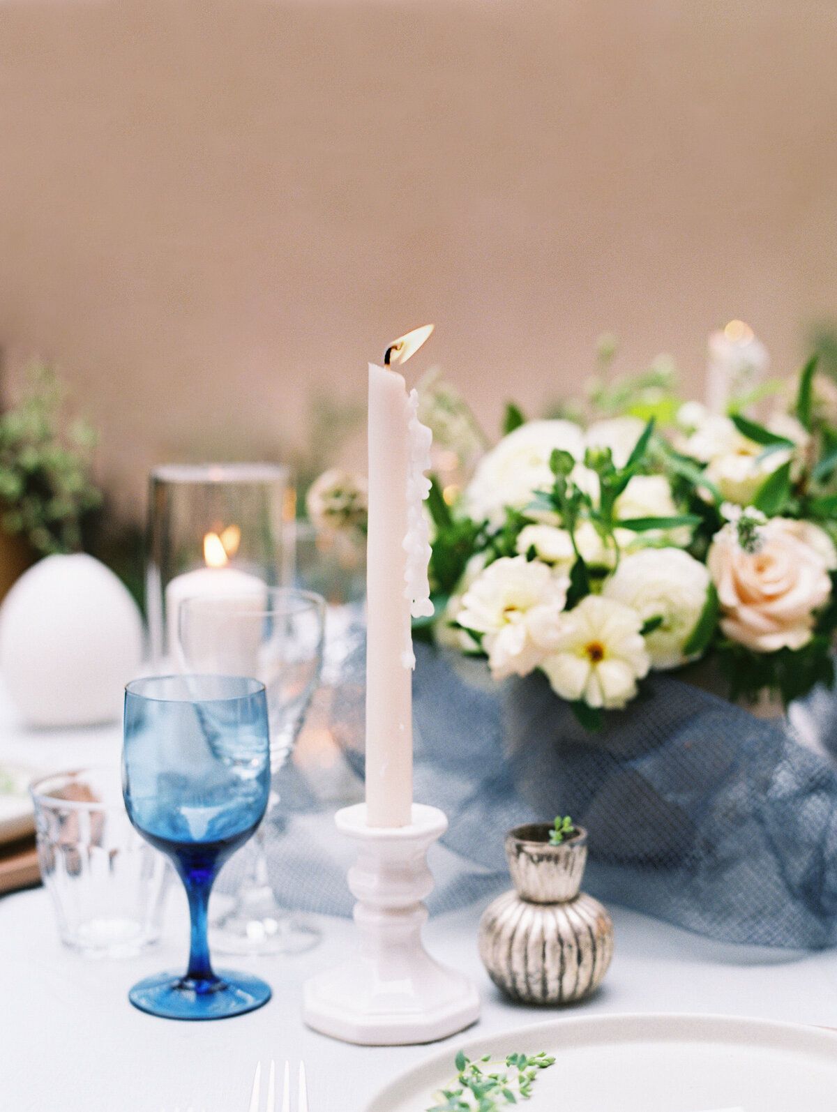 french blue glassware and taper candle